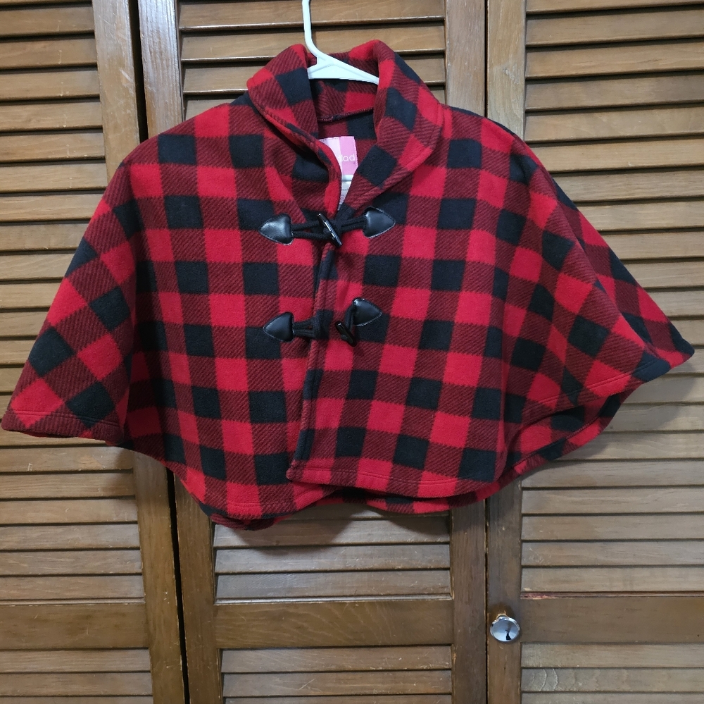 Good Lad Children's red and black buffalo plaid cape with toggle closures.